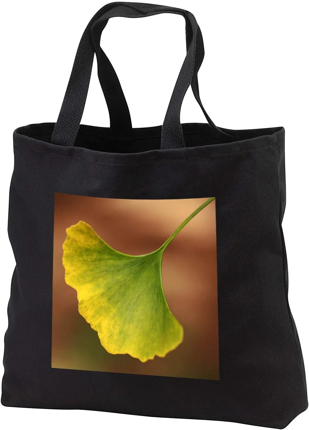 3dRose Macro photograph of a single ginkgo biloba leaf changing for autumn. - Tote Bags (tb_341074)